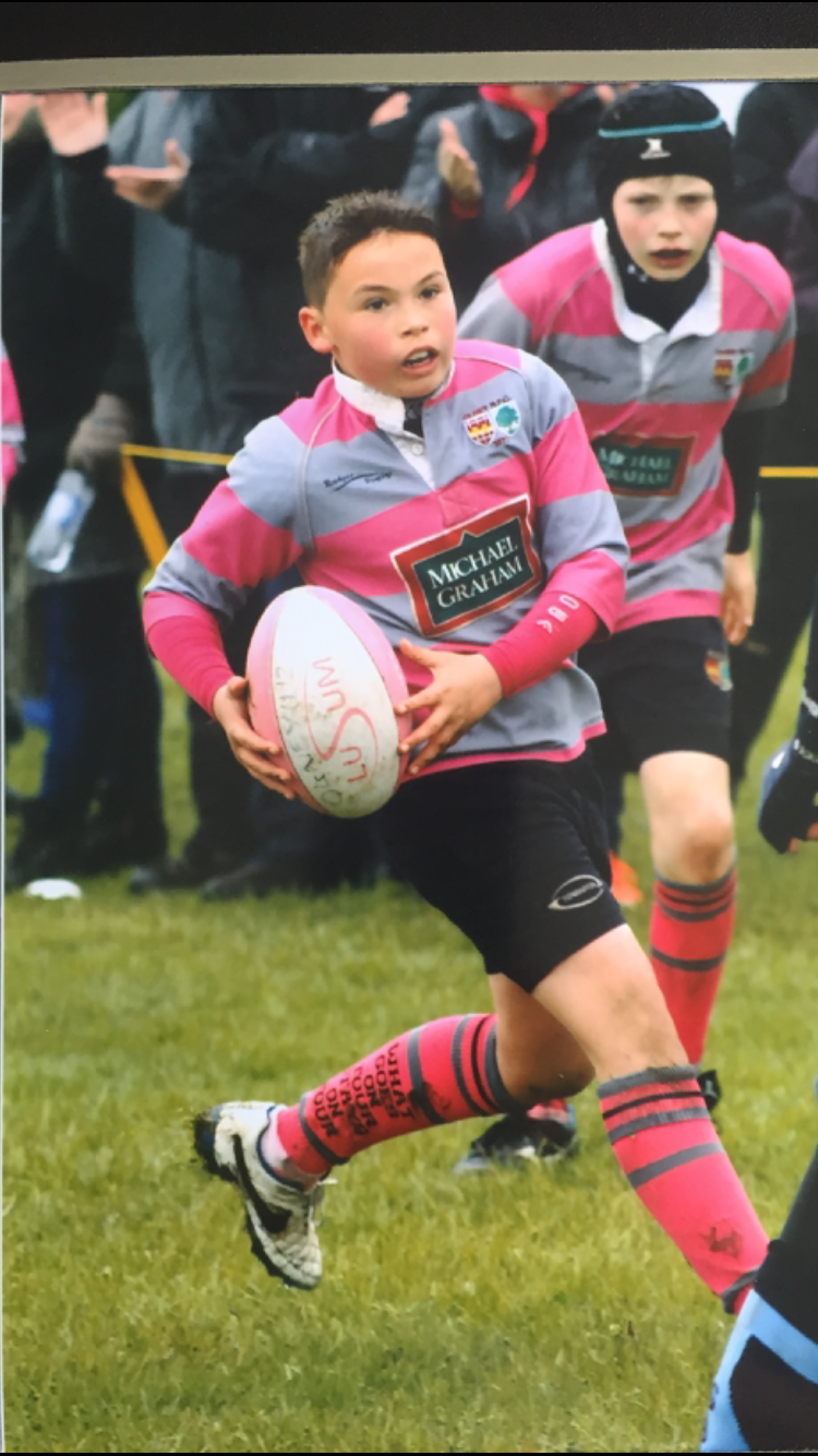 Harry playing rugby